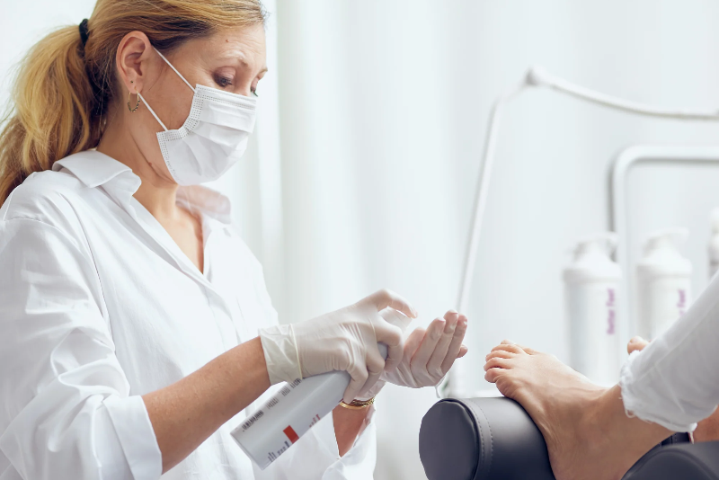 Foot-care professional treating a patient